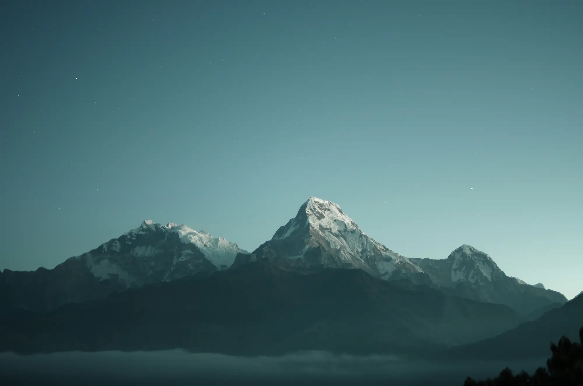 Traveller looking out over a mountain landscape